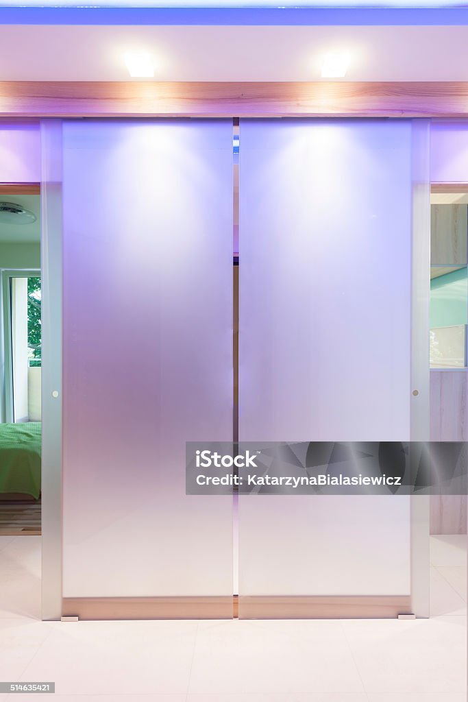 Modern illuminated door Modern illuminated door in luxurious apartment, vertical Sliding Door Stock Photo