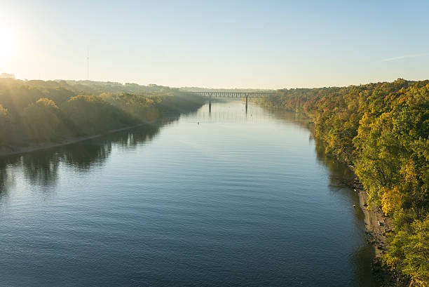 Mississippi River in Morning Light in Minnesota A Calm Mississippi River in Morning Light in Minneapolis, Minnesota. mississippi river stock pictures, royalty-free photos & images