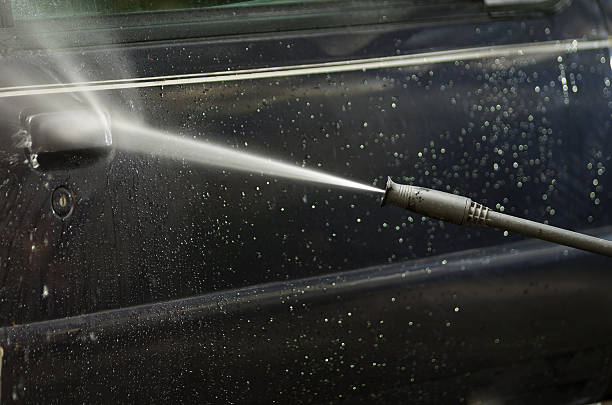 istock Closeup high pressure water cleaner as seen spraying on dark 514638264