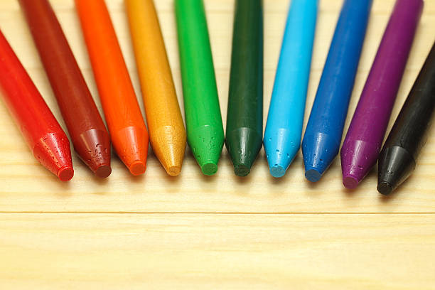 istock rainbow  wax crayons  on wood 514638296