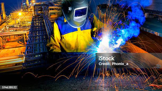 Industrial Worker In Action Welding Close Up Stock Photo - Download Image Now - Welder, Welding, Construction Industry