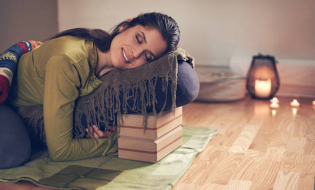 istock Attractive mixed race woman doing restorative yoga 514639270