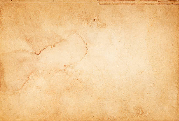Old stained paper texture. Aging dirty paper background for the design. olden stock pictures, royalty-free photos & images