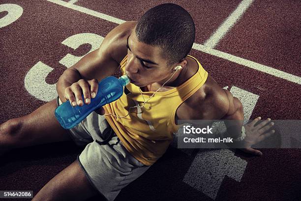 Sport Young Athlete Drinking Water Of Bottle After Running Stock Photo - Download Image Now