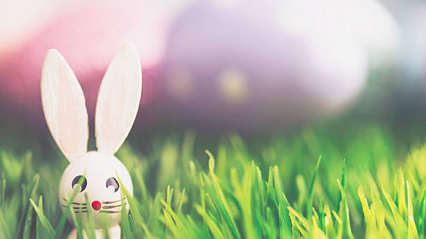 istock Easter arrangement with decorated eggs and vintage wood bunny 514642622