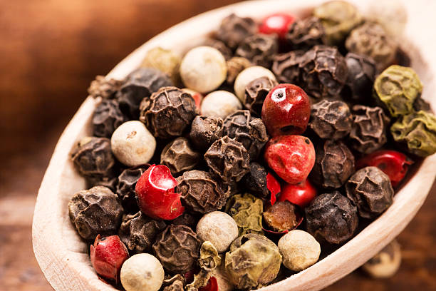 istock Pepper seeds in wooden spoon on wood table 514643390