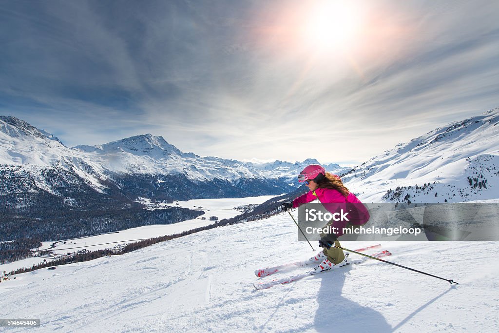 Female skier on track Female skier in downhill slope Skiing Stock Photo