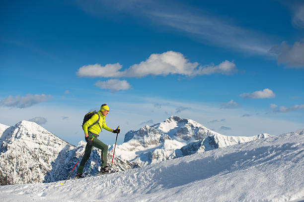 istock Man snowshoeing in mountain 514645506