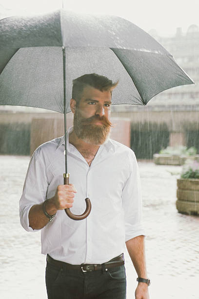 istock Businessman With Umbrella In The Rain 514646142