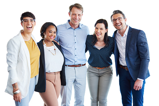 Studio portrait of a team of colleagues standing together in unity against a white background