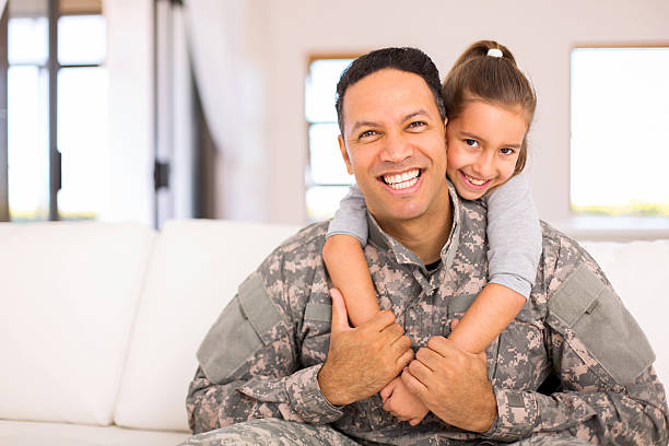 little daughter and military father beautiful little daughter and military father at home military lifestyle stock pictures, royalty-free photos & images