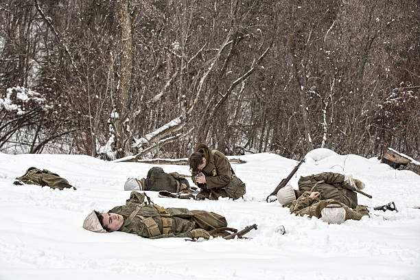 istock WWII Army Soldier Praying the Rosary Amidst His Fallen Platoon 514649540