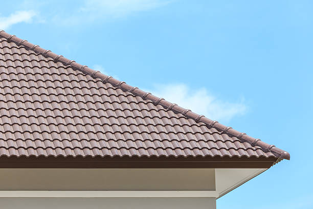 istock roof under construction with stacks of tiles for home building 514651079