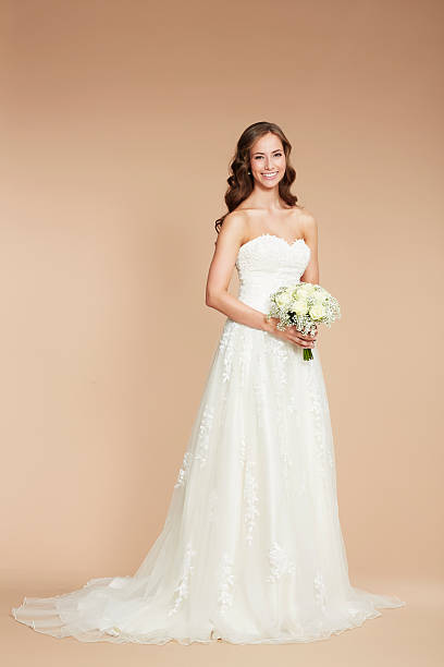 istock Young bride in wedding dress, studio shot 514653813