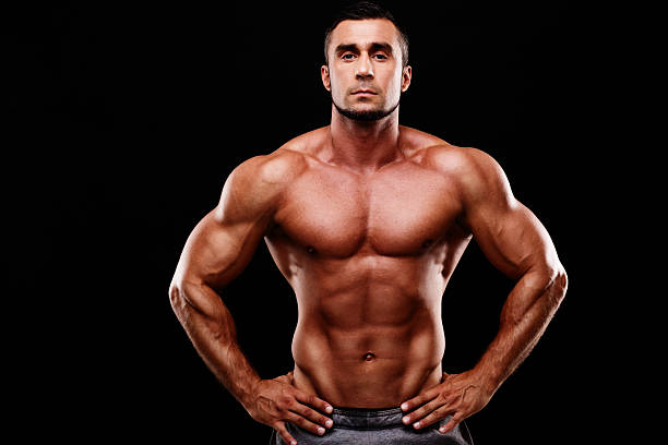 istock muscular man shirtless wearing white pants 514655045