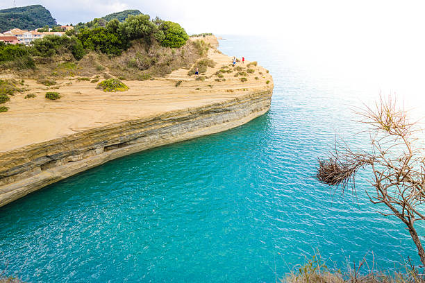 Beach, crystal clear water in Mediterranean sea near to cliff. Kemer, Turkey.