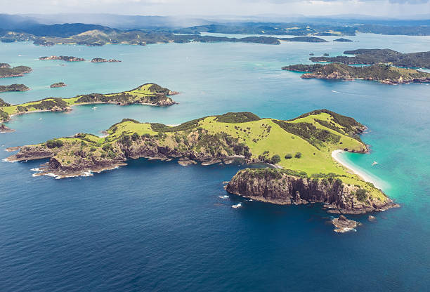 Bay of Islands from the air An aerial view over the Bay of Islands in New Zealand's Northland Region. bay of islands new zealand stock pictures, royalty-free photos & images