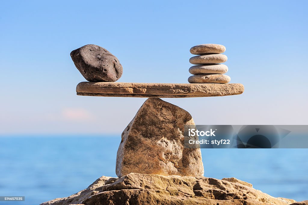 Symbol of scales Symbol of scales is made of stones on the boulder Balance Stock Photo
