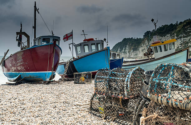 istock Fishing boats on Beer Beach, Dorset 514657407