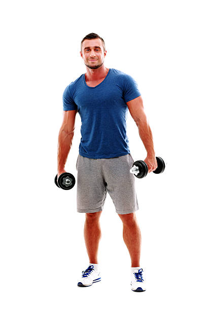 istock happy muscular man standing with dumbbells 514671157
