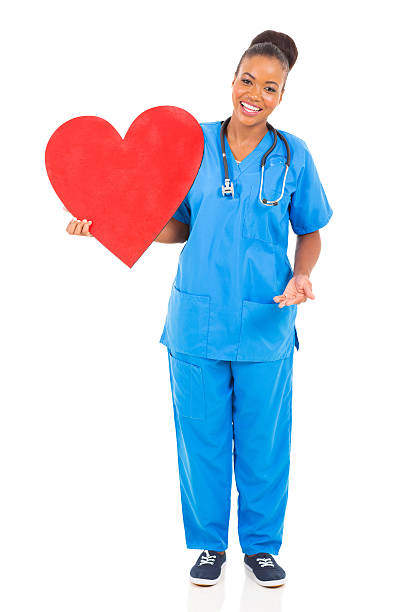 istock young african american doctor holding heart 514671411