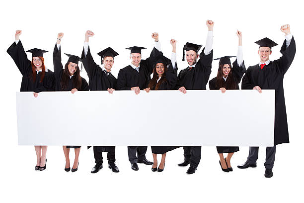 istock Cheerful excited graduate students showing empty banner 514672711