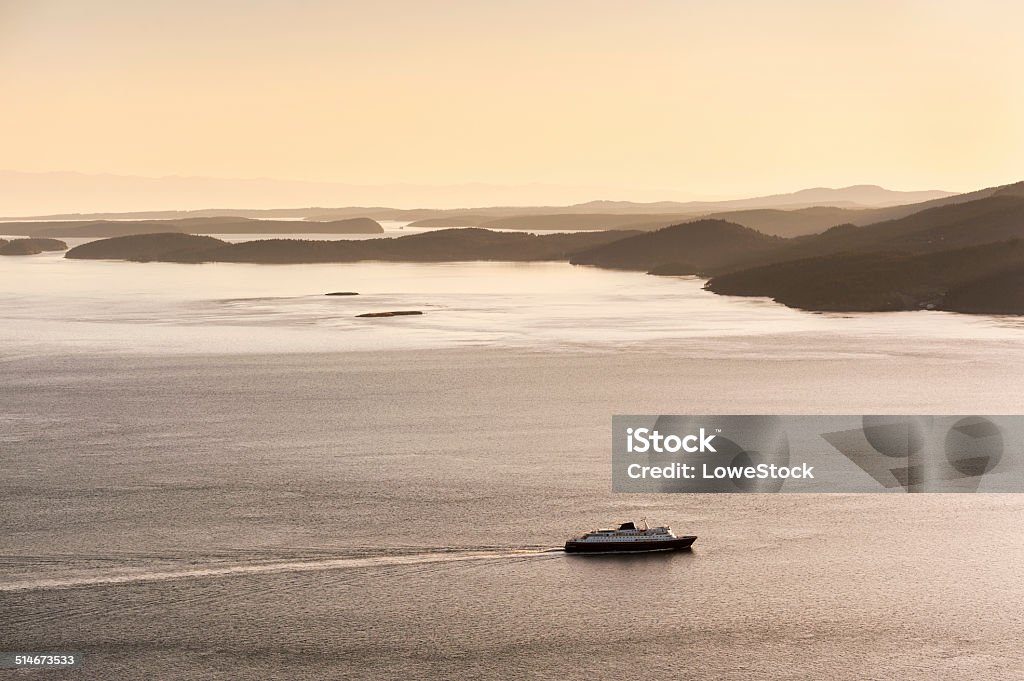 The Alaska Ferry The Alaska ferry en route to Ketchikan and beyond from Bellingham, Washington. Sunset over the San Juan Islands of Puget Sound in western Washington State, USA. Sea Stock Photo