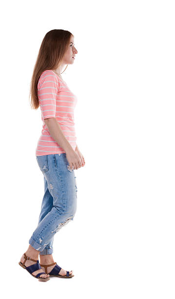 istock back view of walking  woman . 514674921