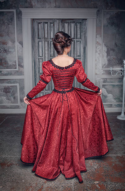 istock Beautiful medieval woman in red dress, back 514675615