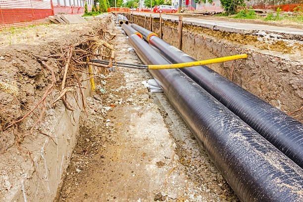 istock Newly laid pipe in a fresh trench. Unfinished pipeline 514677589