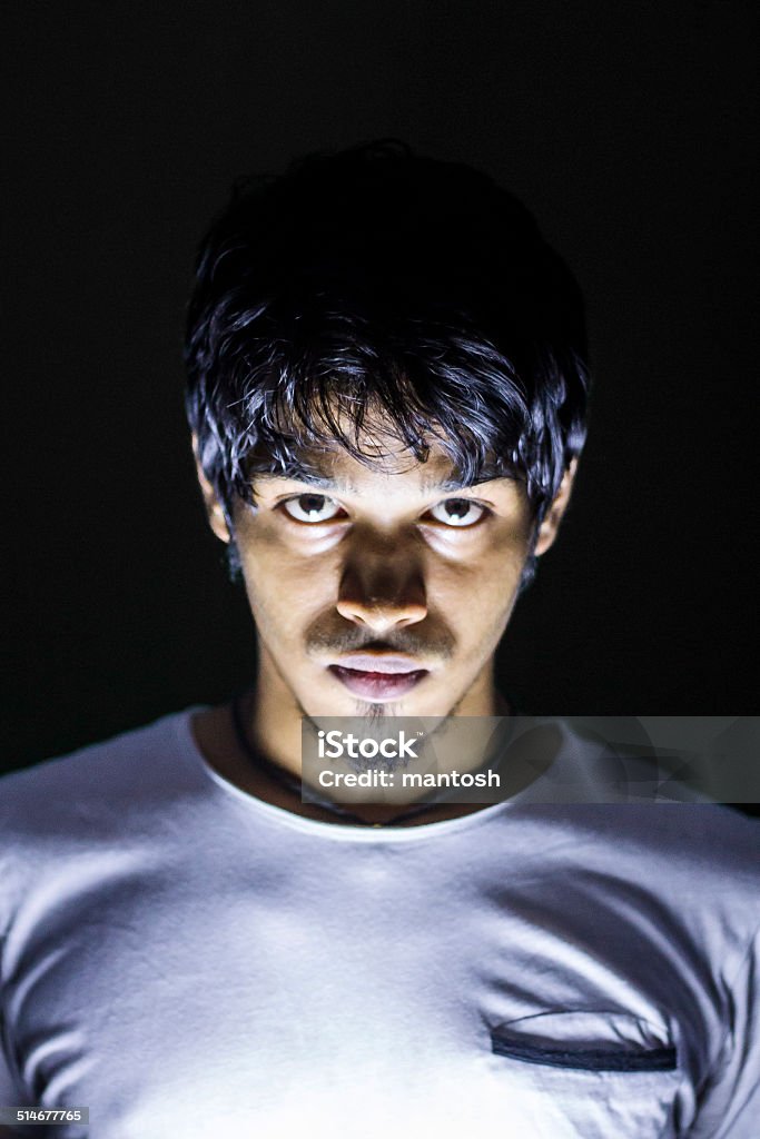 Portrait of a young man Shot on dark background. Actor Stock Photo