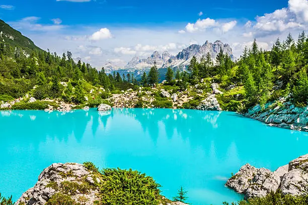 Turquoise Sorapis Lake  in Cortina d'Ampezzo, with Dolomite Mountains and Forest - Sorapis Circuit, Dolomites, Italy, Europe