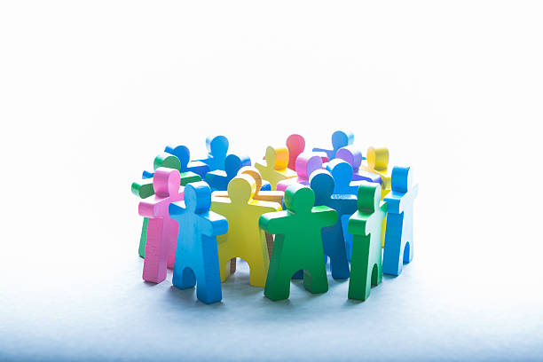 istock Wooden people doll standing together as team 514685179