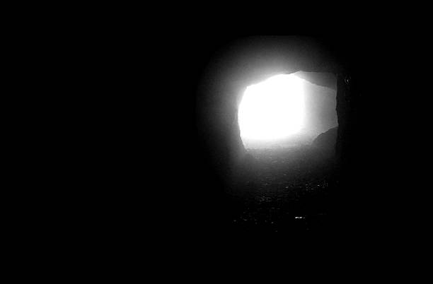 istock tunnel with the light that filters in the end 514685233
