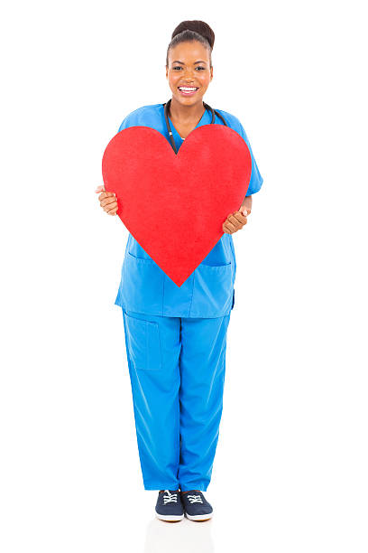 istock african nurse holding heart 514685489