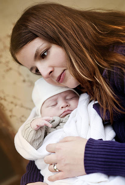 istock Mother with baby by the old house 514686041