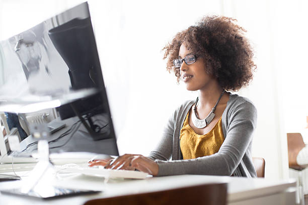 Candid portrait of a young women working Candid portrait of a young women working at a startup or at a small business founder photos stock pictures, royalty-free photos & images