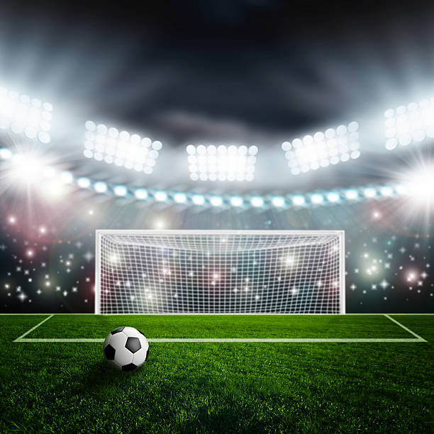 istock Soccer ball on green stadium arena 514687661