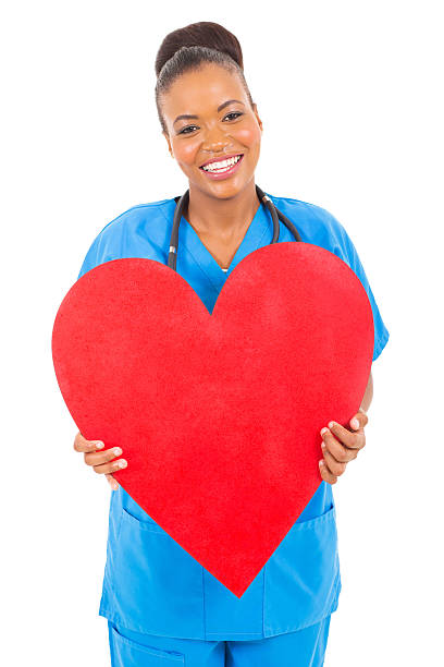 istock cute african doctor holding heart 514688413