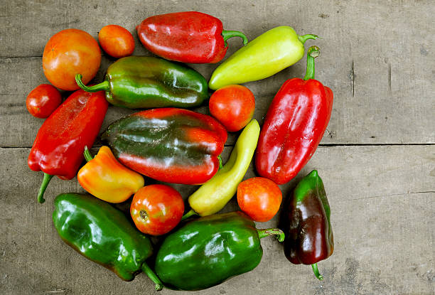 Red and green peppers and tomato stock photo