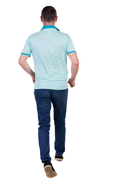 istock Back view of running man in blue polo. 514690083
