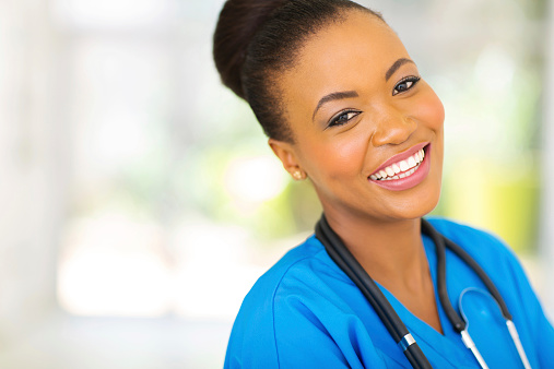 happy african nurse looking at the camera