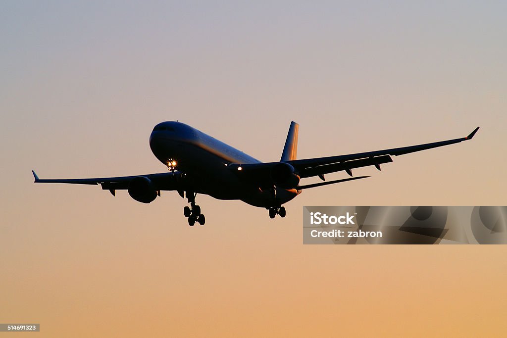 Airplane silhouette Silhouette of an aiplane shortly before landing. Air Vehicle Stock Photo