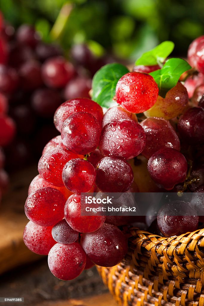 Organic Raw Red Grapes Organic Raw Red Grapes in a Basket Berry Stock Photo