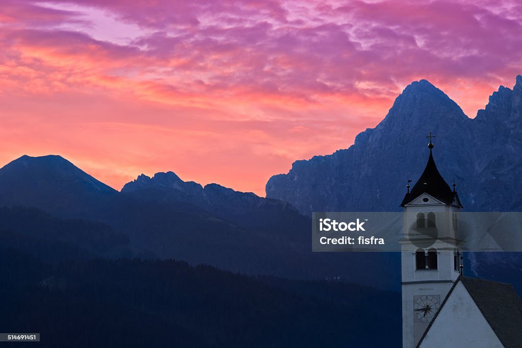 Dolomites Church Colle Santa Lucia at sunrise, Alps, Italy Alto Adige - Italy Stock Photo