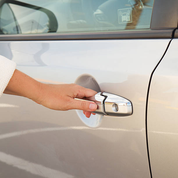 istock woman opens car door close up 514691499