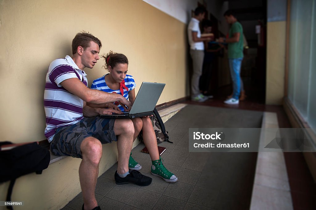 Students at school with laptop Adult Stock Photo