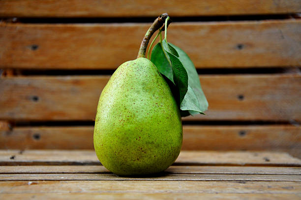 pear on a wooden table stock photo