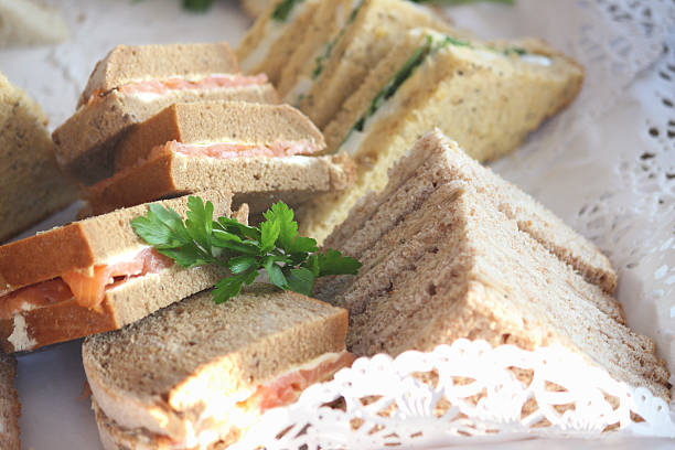 istock Triangular granary bread sandwiches, egg / lettuce, smoked salmon, ham, party-food-buffet 514692727