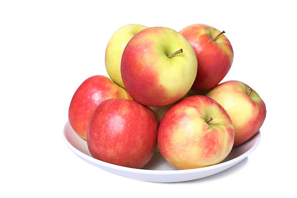 istock Dish full of fresh apples isolated on a white background 514692791